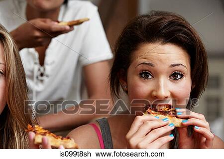 Teenage girl eating pizza View Large Photo Image Stock Image - Teenage girl eating pizza. Fotosearch