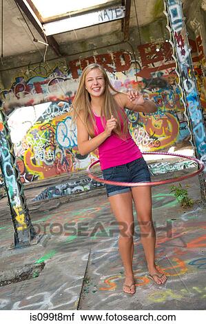 Teenage girl hula hooping View Large Photo Image Stock Image - Teenage girl hula hooping. Fotosearch