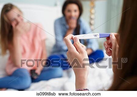 Teenage girl with pregnancy test View Large Photo Image Stock Image - Teenage girl with pregnancy test. Fotosearch