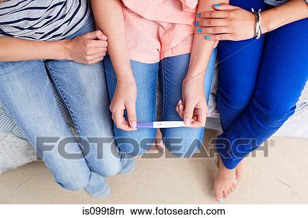 Teenage girls with pregnancy test View Large Photo Image Picture - Teenage girls with pregnancy test. Fotosearch