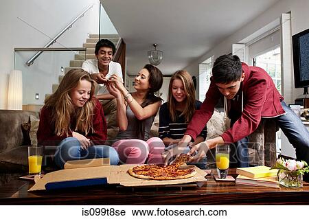 Teenagers having take away pizza View Large Photo Image Stock Image - Teenagers having take away pizza. Fotosearch