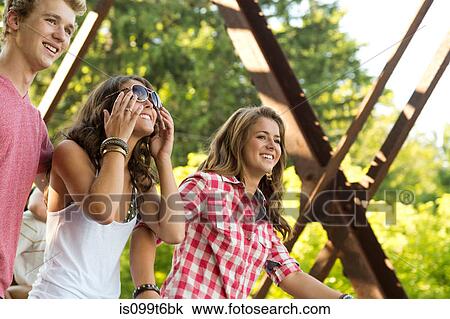 Three friends on bridge View Large Photo Image Stock Image - Three friends on bridge. Fotosearch