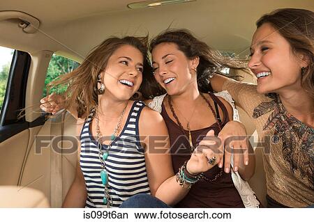 Three girls in back seat of car View Large Photo Image Picture - Three girls in back seat of car. Fotosearch