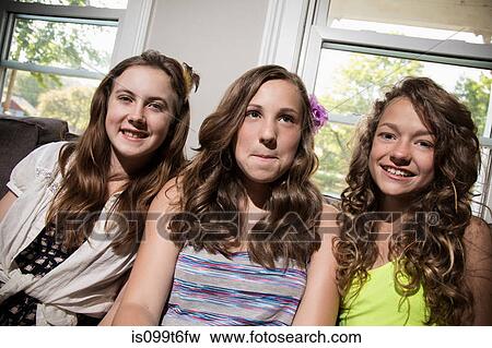 Three girls looking at camera View Large Photo Image Stock Photo - Three girls looking at camera. Fotosearch