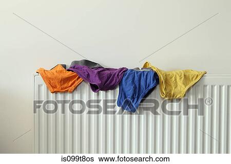 Underwear drying on radiator View Large Photo Image Stock Photograph - Underwear drying on radiator. Fotosearch