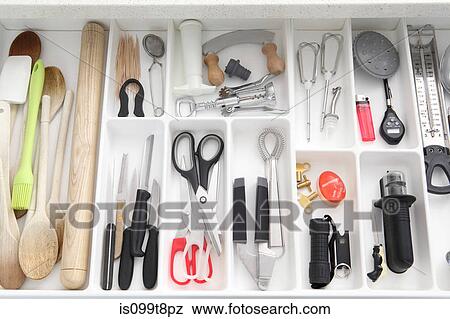 Stock Photo - Utensils in kitchen drawer. Fotosearch