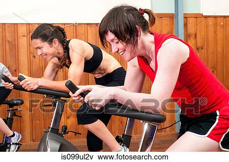 Women in spinning class View Large Photo Image Stock Photo - Women in spinning class. Fotosearch