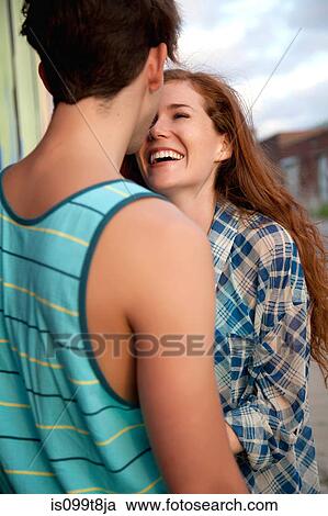 Stock Image - Young couple laughing. Fotosearch