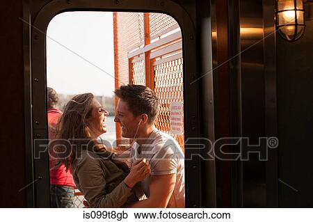 Stock Image - Young couple on a ferry. Fotosearch