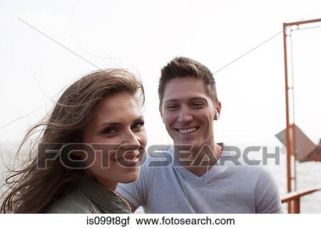 Young couple outdoors View Large Photo Image Stock Image - Young couple outdoors. Fotosearch