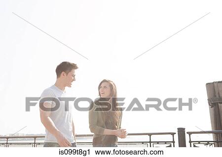 Stock Image - Young couple walking. Fotosearch