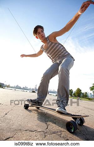 Young man skateboarding View Large Photo Image Stock Photo - Young man skateboarding. Fotosearch