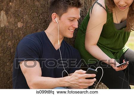 Young people listening to music View Large Photo Image Stock Photography - Young people listening to music. Fotosearch