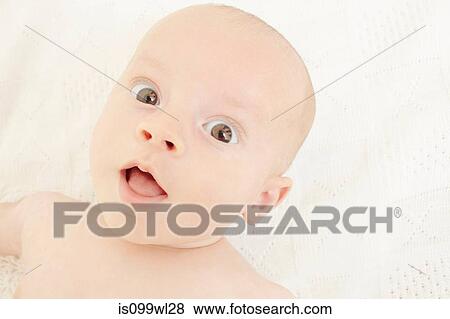 Baby girl staring at camera View Large Photo Image Stock Photo - Baby girl staring at camera. Fotosearch