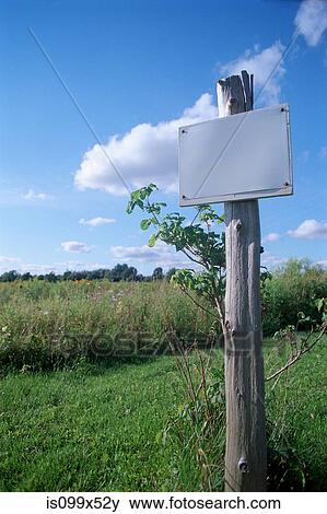 Stock Photo - Blank sign in a field. Fotosearch