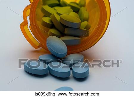 Blue pills spilling from bottle View Large Photo Image Stock Photography - Blue pills spilling from bottle. Fotosearch