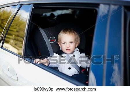 Boy in car View Large Photo Image Stock Photography - Boy in car. Fotosearch
