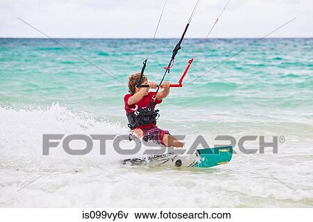 Boy kitesurfing View Large Photo Image Stock Photo - Boy kitesurfing. Fotosearch