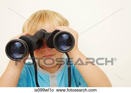 Boy looking through binoculars View Large Photo Image Picture - Boy looking through binoculars. Fotosearch