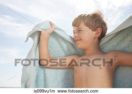 Picture - Boy outdoors with a towel. Fotosearch