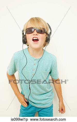 Boy wearing headphones and sunglasses View Large Photo Image Stock Photography - Boy wearing headphones and sunglasses. Fotosearch