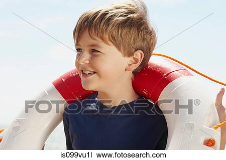 Boy with a life ring View Large Photo Image Stock Image - Boy with a life ring. Fotosearch
