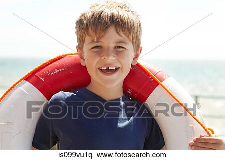 Boy with a life ring View Large Photo Image Stock Photography - Boy with a life ring. Fotosearch