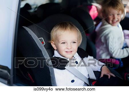 Picture - Brother and sister in car. Fotosearch