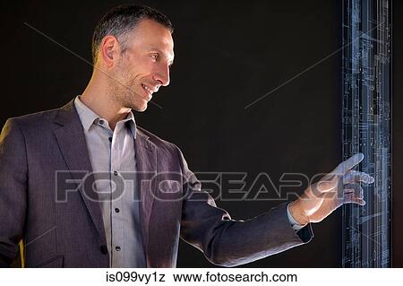 Businessman touching virtual information View Large Photo Image Stock Photo - Businessman touching virtual information. Fotosearch