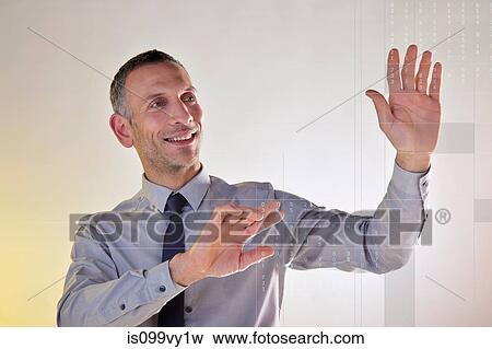 Businessman using virtual data View Large Photo Image Stock Photo - Businessman using virtual data. Fotosearch