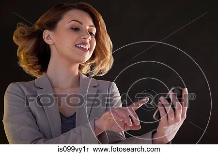 Businesswoman using smartphone touch screen with circles View Large Photo Image Stock Photography - Businesswoman using smartphone touch screen with circles. Fotosearch