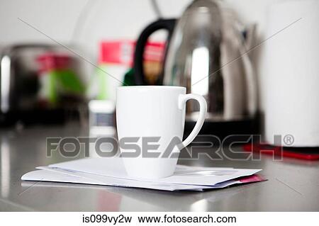 Coffee mug on top of envelopes View Large Photo Image Stock Photo - Coffee mug on top of envelopes. Fotosearch