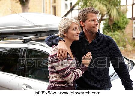Couple by car View Large Photo Image Stock Photo - Couple by car. Fotosearch