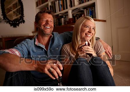 Couple drinking wine at home View Large Photo Image Picture - Couple drinking wine at home. Fotosearch