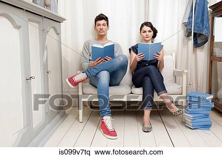 Stock Photography - Couple holding books. Fotosearch