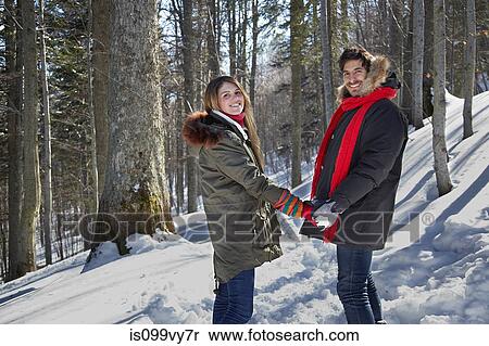Couple holding hands in snow View Large Photo Image Stock Photography - Couple holding hands in snow. Fotosearch