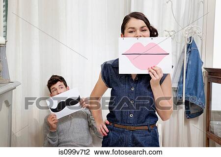 Couple holding lips and moustache View Large Photo Image Stock Image - Couple holding lips and moustache. Fotosearch