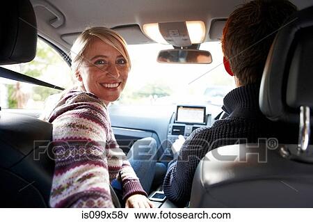 Couple inside car View Large Photo Image Stock Photo - Couple inside car. Fotosearch
