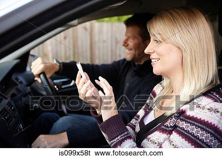 Couple inside car View Large Photo Image Stock Photograph - Couple inside car. Fotosearch