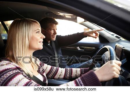 Couple inside car View Large Photo Image Stock Photograph - Couple inside car. Fotosearch
