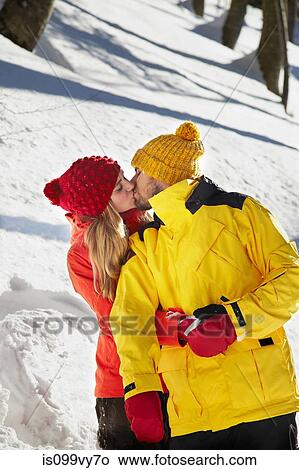 Couple kissing in snow View Large Photo Image Picture - Couple kissing in snow. Fotosearch