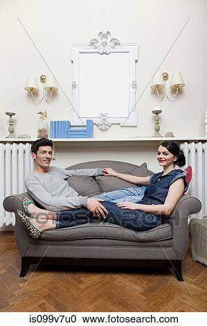 Couple on sofa View Large Photo Image Stock Image - Couple on sofa. Fotosearch
