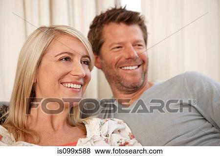Couple watching television View Large Photo Image Stock Photo - Couple watching television. Fotosearch
