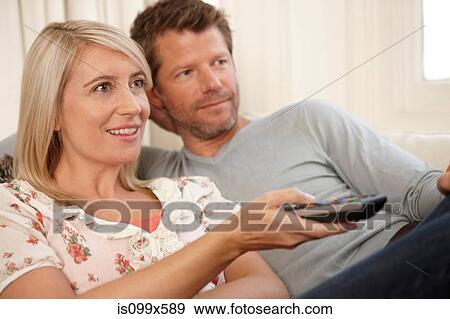 Stock Photo - Couple watching television. Fotosearch