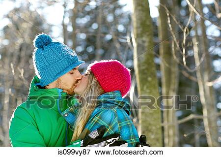 Couple wearing knit hats, kissing View Large Photo Image Stock Photo - Couple wearing knit hats, kissing. Fotosearch