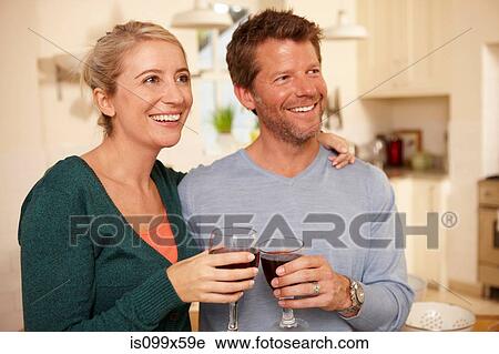 Stock Image - Couple with red wine. Fotosearch