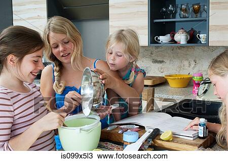 Four girls baking in kitchen View Large Photo Image Stock Image - Four girls baking in kitchen. Fotosearch