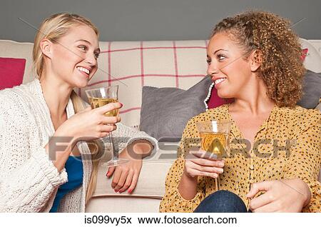 Stock Photo - Friends with white wine. Fotosearch