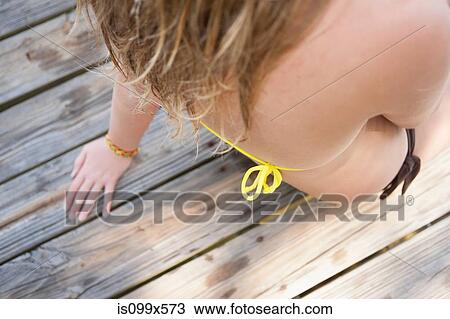Girl sitting on jetty View Large Photo Image Stock Image - Girl sitting on jetty. Fotosearch