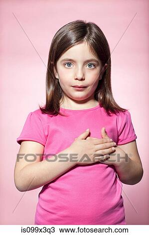 Stock Image - Girl with hands on heart. Fotosearch